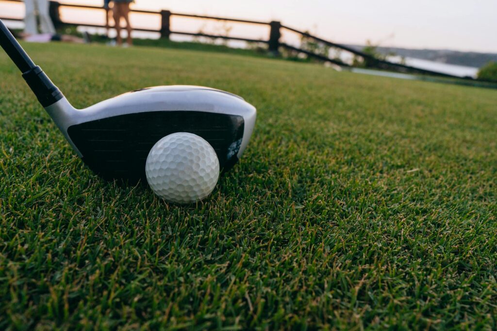 A close-up image of a golf driver face showcasing different materials. — golf driver design