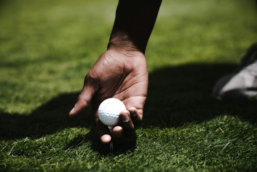 A close-up of a golfer's grip showcasing the correct technique. — beginner golf Dungeness