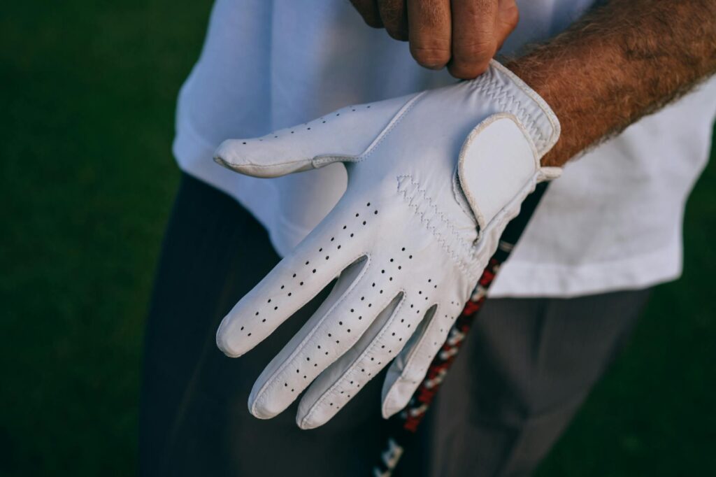 A golfer adjusting their grip in windy conditions. — science of golf swing weather