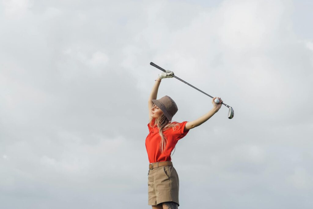 A golfer hydrating and stretching, addressing health considerations for golfing at altitude. — golf etiquette high altit…