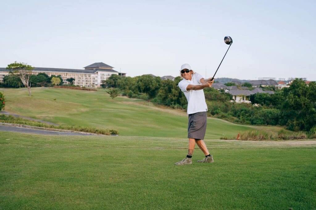 A golfer practicing swing mechanics at a mountain course. — improve golf game high altitude