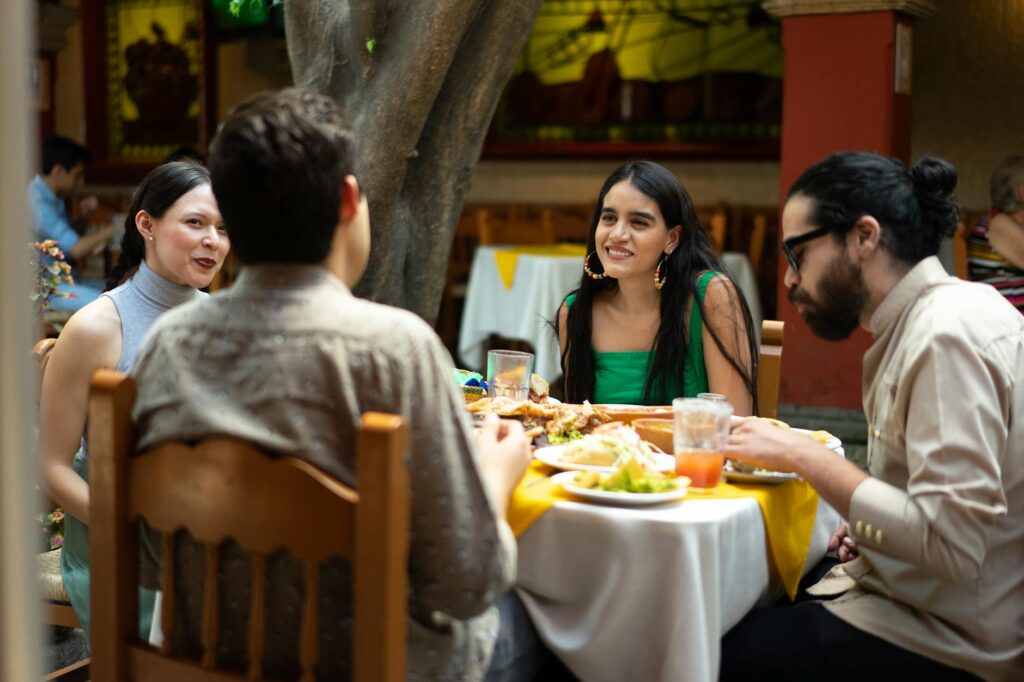 A group of friends enjoying a meal at a local restaurant in Dungeness. — golf trip Dungeness