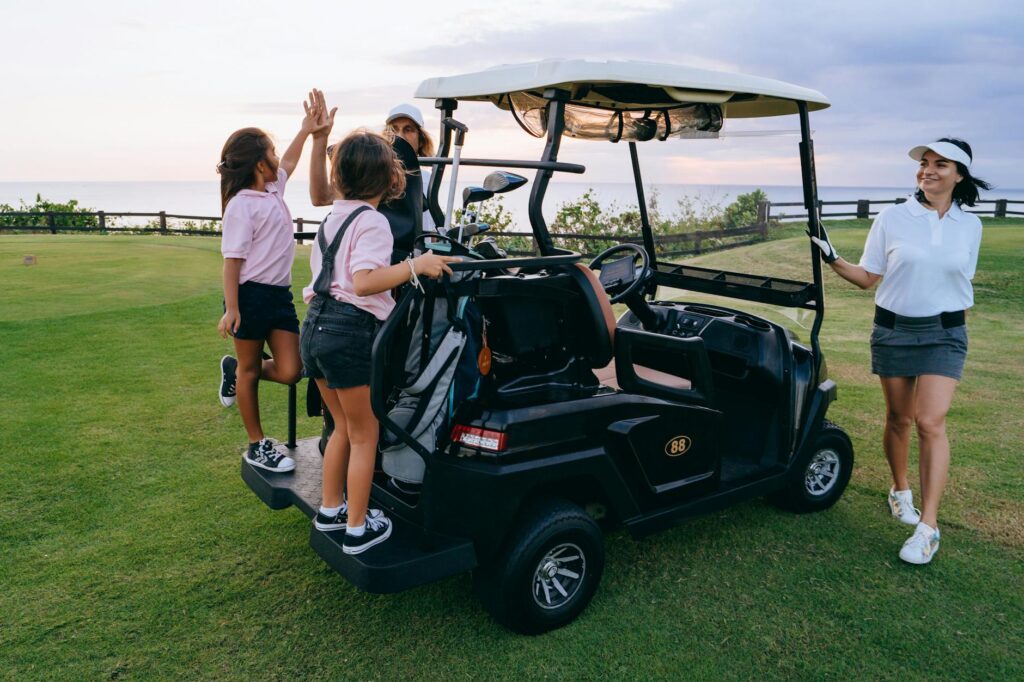 A group of friends enjoying a round of golf at a Dungeness course. — Dungeness golf courses