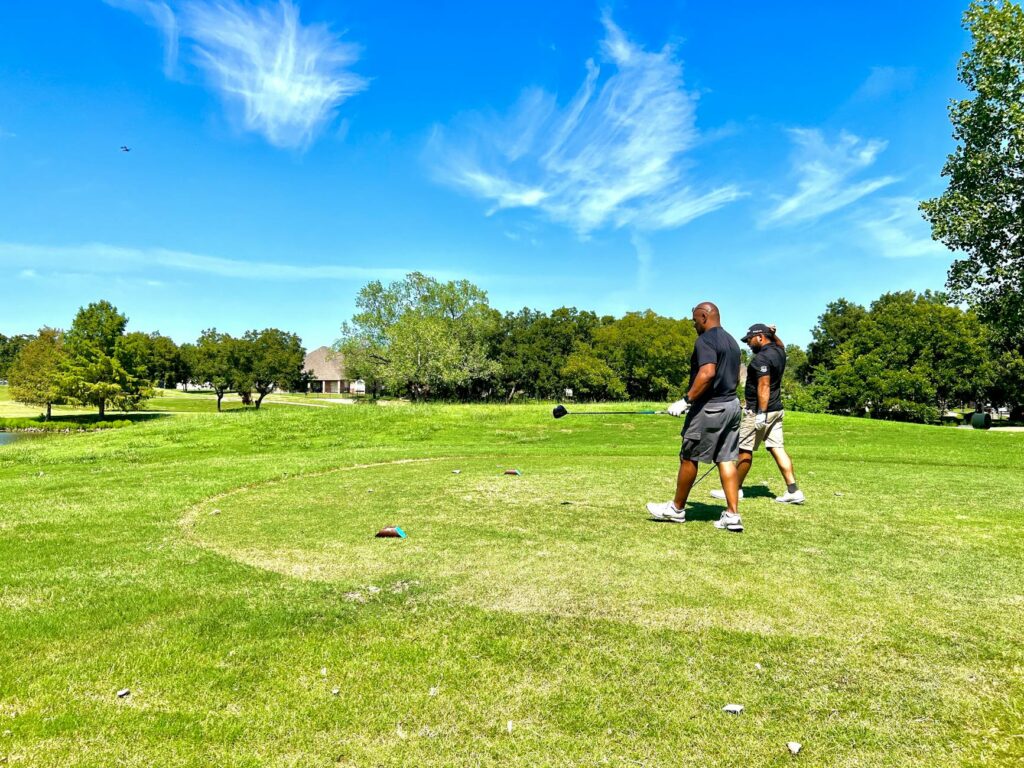 A group of friends enjoying a round of golf together on a sunny day in Dungeness. — beginner golf Dungeness