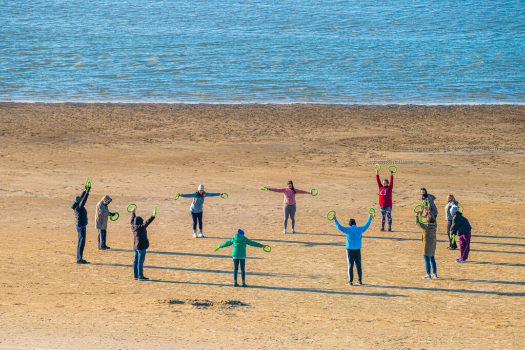 A group of golfers participating in a training session on Dungeness beach. — improve golf swing Dungeness