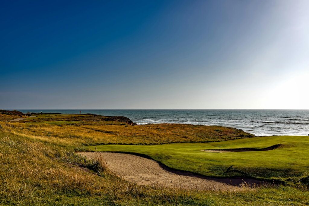 A scenic view of a golf course in Dungeness with coastal backgrounds. — golf trip Dungeness