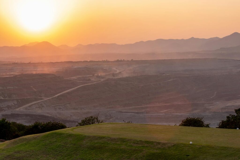 A stunning view of a mountain golf course highlighting the elevation — golf course maintenance altitude