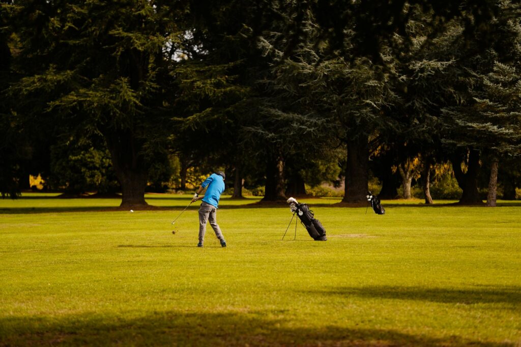 A sunny summer day at a Dungeness golf course, showcasing players enjoying the game. — best time to golf Dungeness