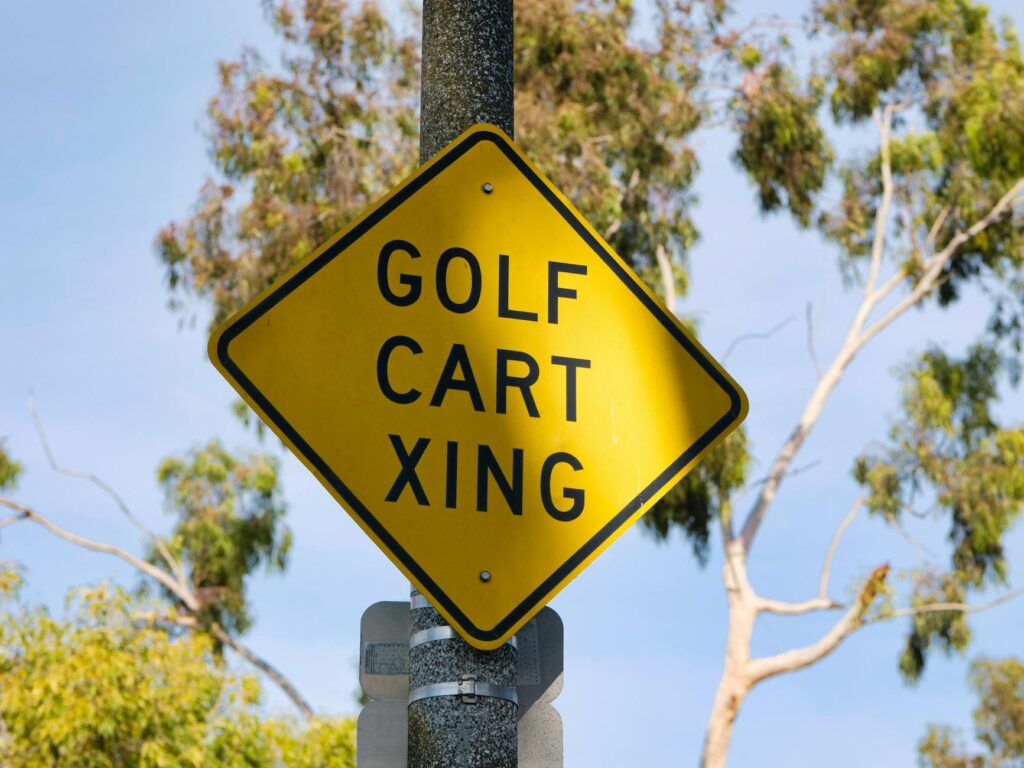 An image of a golf course sign warning about foggy conditions, illustrating the importance of golf safety tips. — golfin…