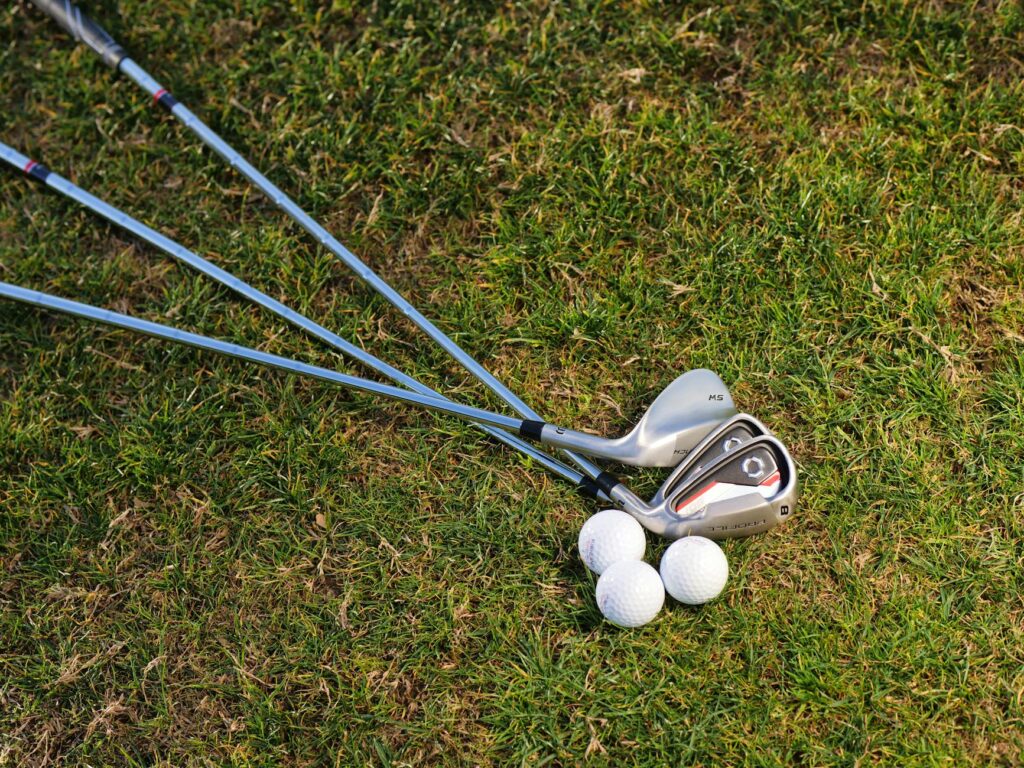 An image showcasing essential golf clubs suitable for coastal play with a focus on golf equipment Dungeness.
