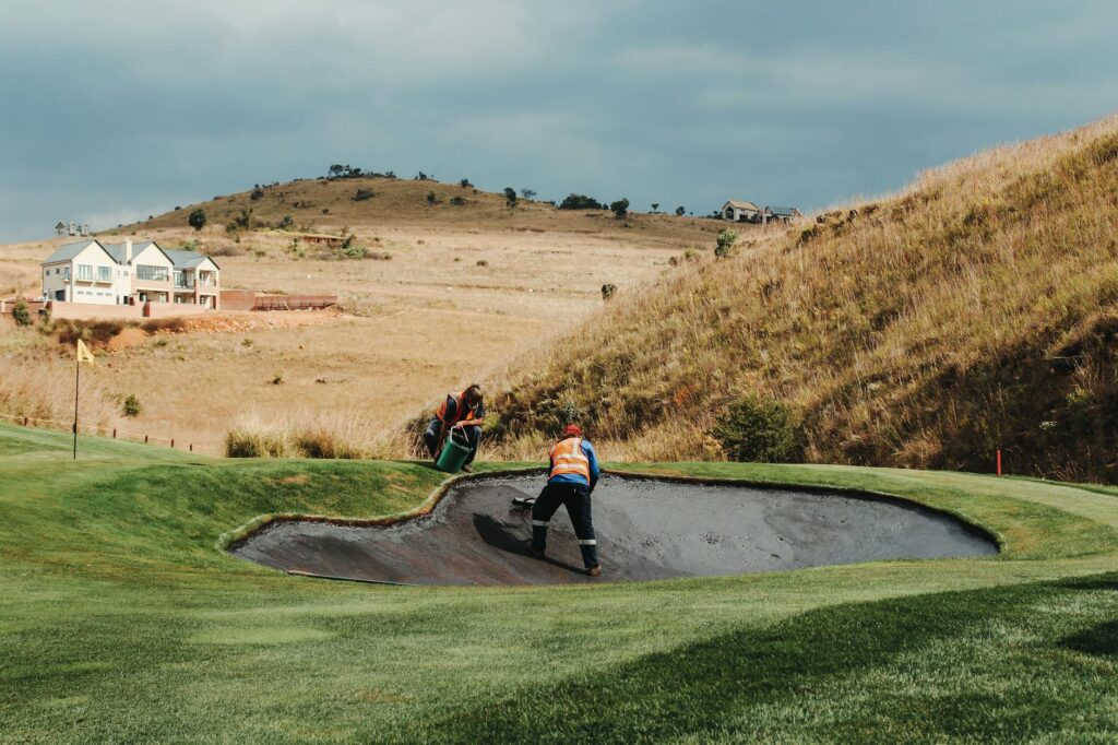 Greenkeepers performing maintenance work at a high-elevation course — golf course maintenance altitude