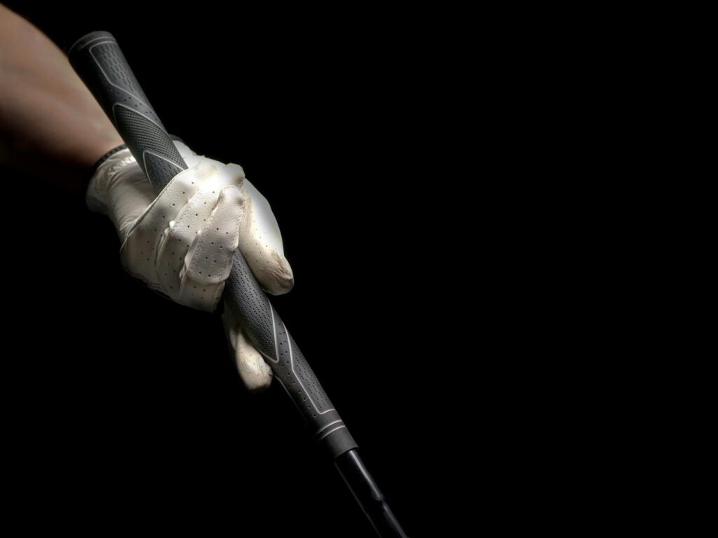 A close-up of a golf driver grip highlighting its texture and material. — golf driver grip size beginners