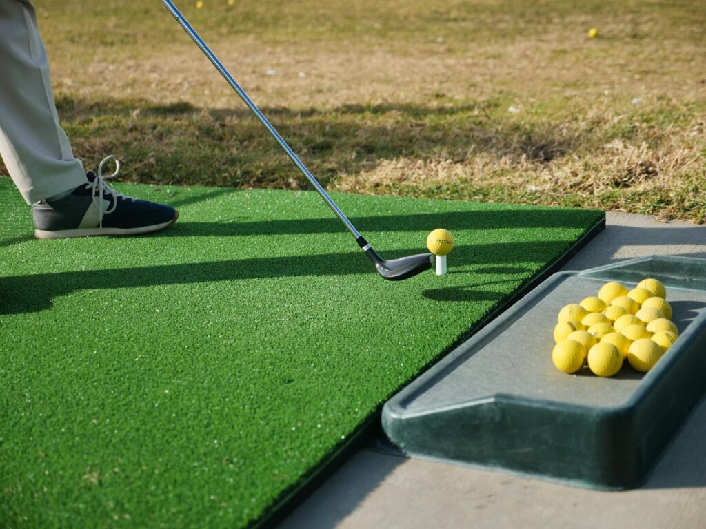 A close-up of alignment sticks set up for swing practice. — golf swing tips Dungeness