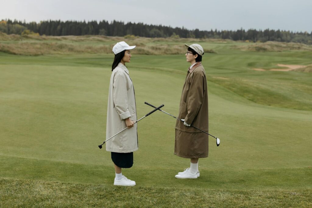 A friendly interaction between golfers, emphasizing the importance of social manners on the course. — golf etiquette Dun…