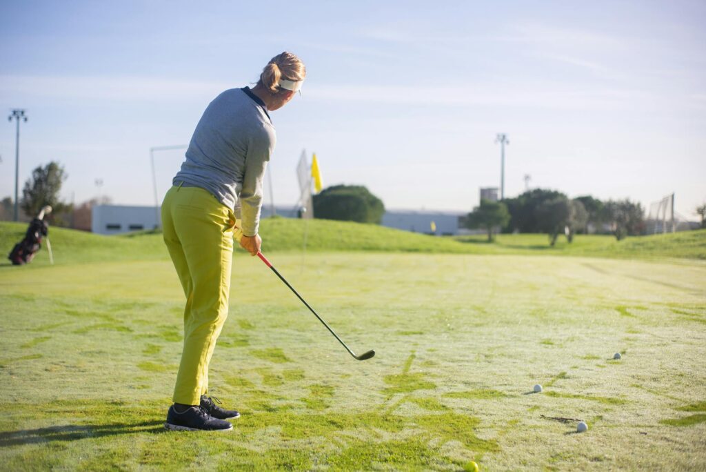 A golfer bundled up and playing in a winter landscape, highlighting the unique challenges of winter golf. — best times t…