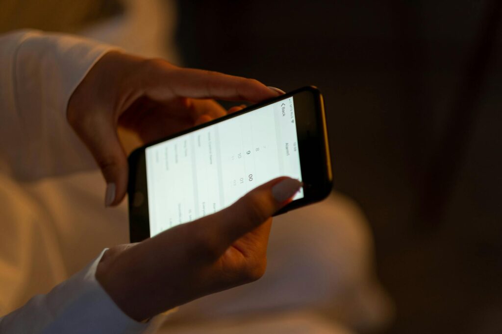 A golfer using a swing analysis app on their phone. — golf swing tips