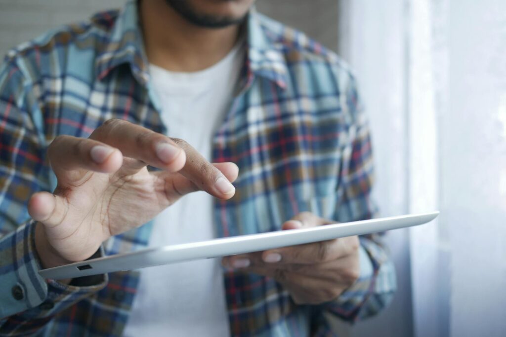 A golfer using technology to analyze their swing on a tablet. — improve golf swing Dungeness
