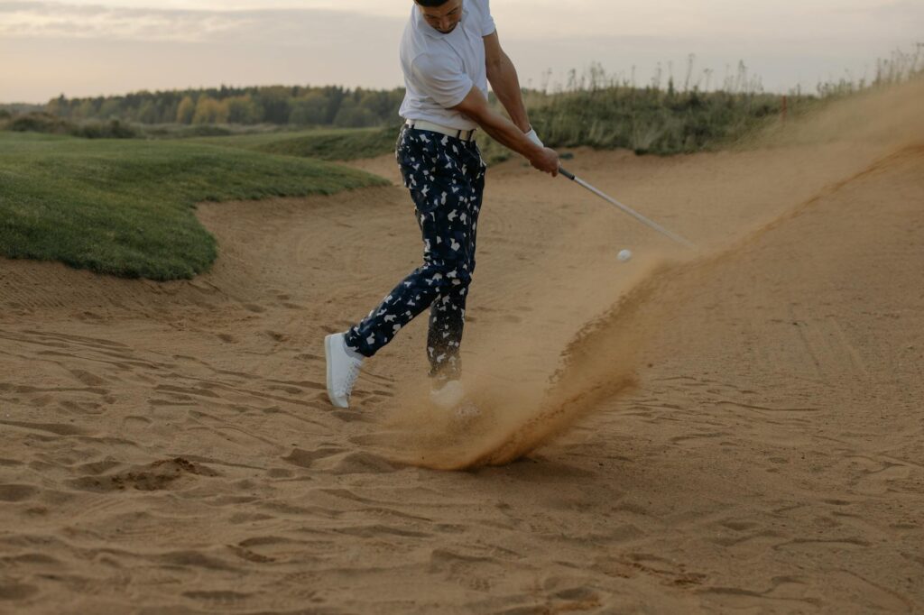 A golfer visualizing their swing before taking a shot on the course. — improve golf swing Dungeness