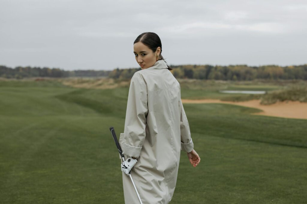 A golfer wearing waterproof apparel on a Dungeness golf course — golf gear for Dungeness