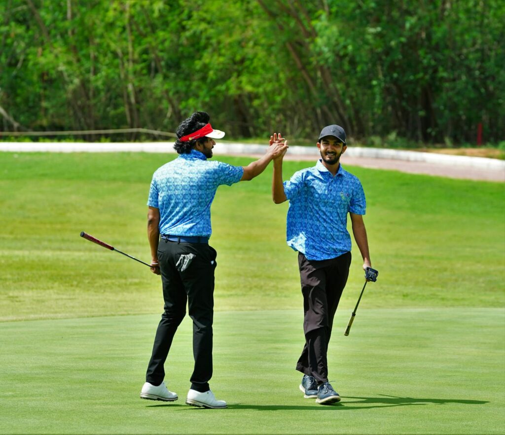 A group of friends celebrating after a successful round of golf. — golf trip Dungeness