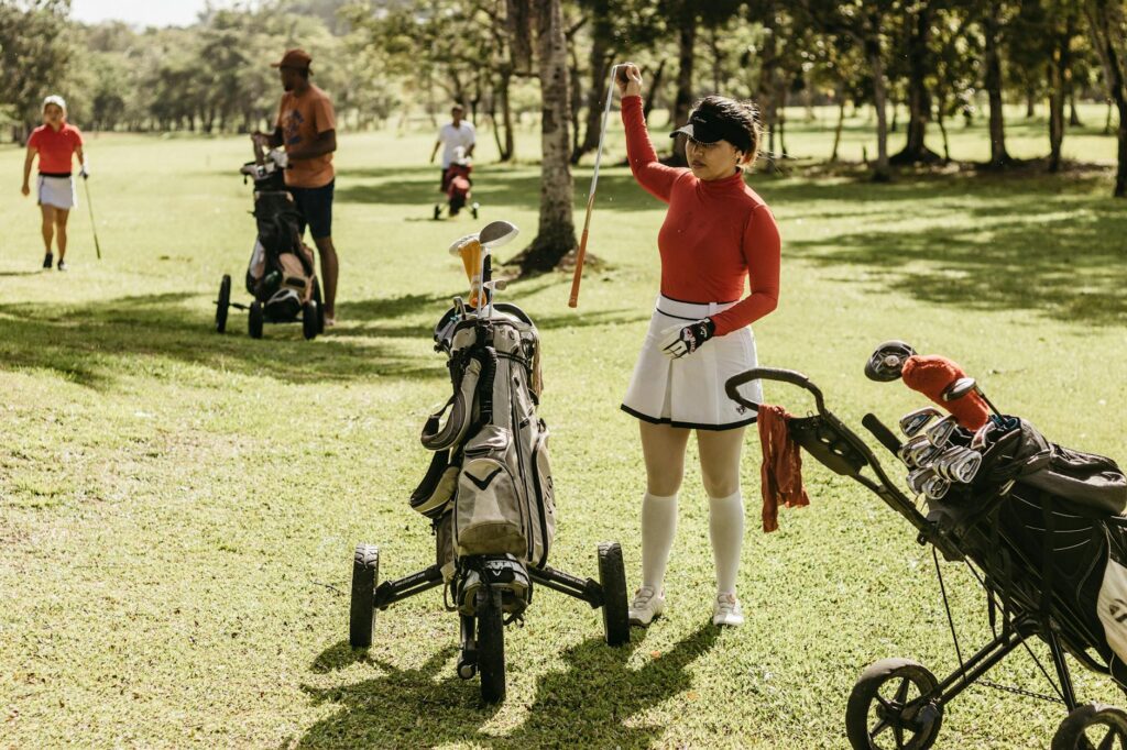 A group of friends enjoying a spring golf tournament in Dungeness. — best time to play golf Dungeness