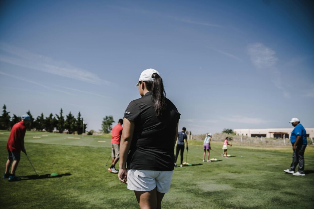 A group of golfers enjoying a sunny day on the Dungeness golf course. — golfing tips Dungeness