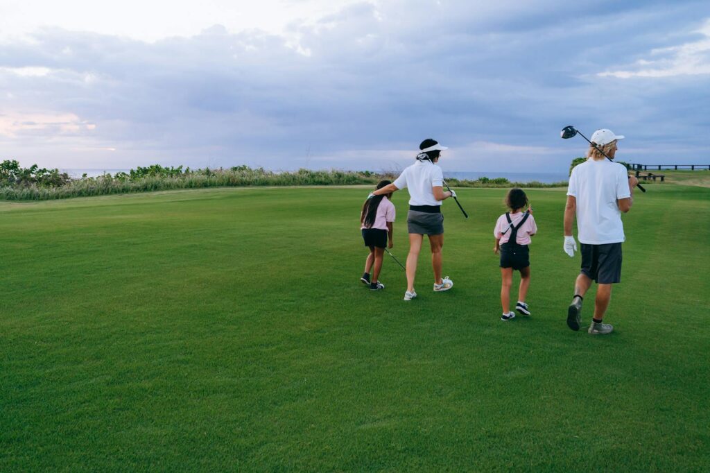 A group of golfers walking together on a fairway, demonstrating good pace of play. — golf etiquette Dungeness