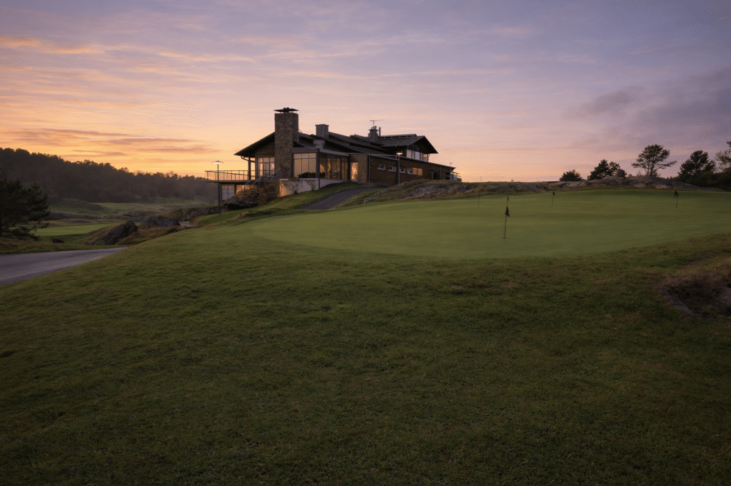 A scenic shot of the 18th hole at Dungeness Golf Course during sunset. — best times Dungeness Golf