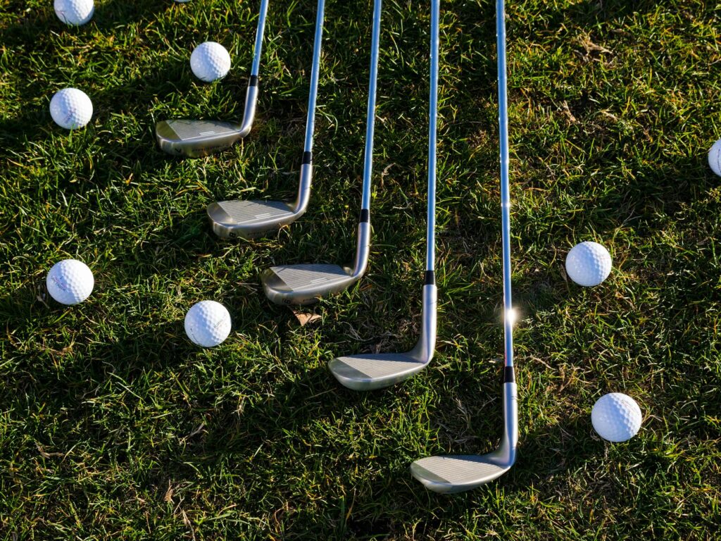 A selection of top-rated beginner golf clubs arranged in an appealing layout. — best beginner golf clubs