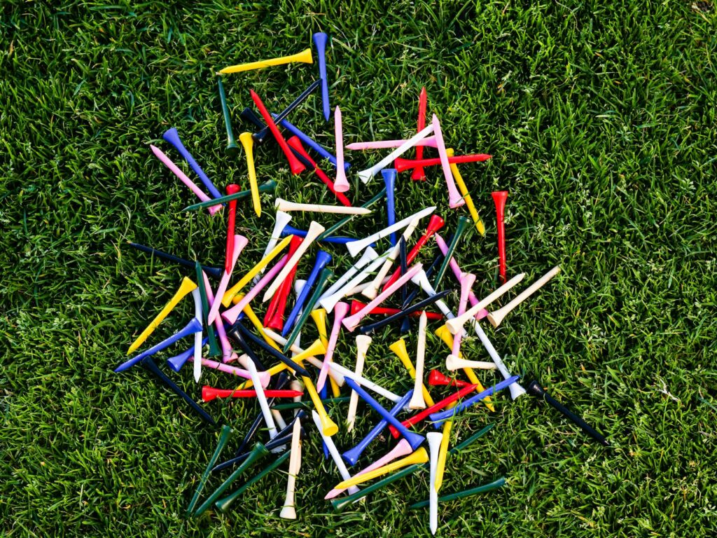 An array of golf accessories Dungeness, including tees and markers. — golf gear Dungeness
