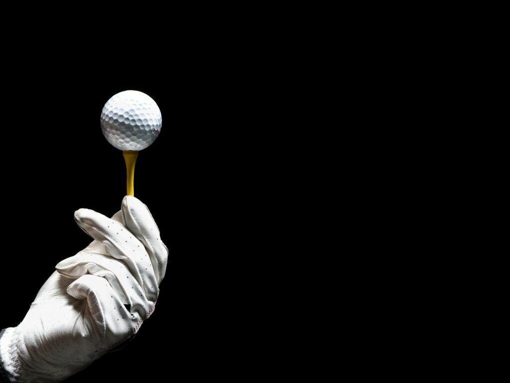 An assortment of essential golf accessories such as tees, gloves, and balls. — golf gear reviews Dungeness