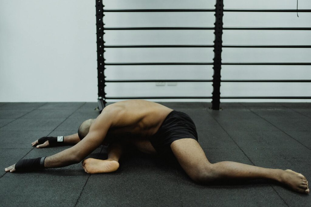 An illustration of static stretching techniques focusing on hamstrings and shoulders. — golf warm-up exercises