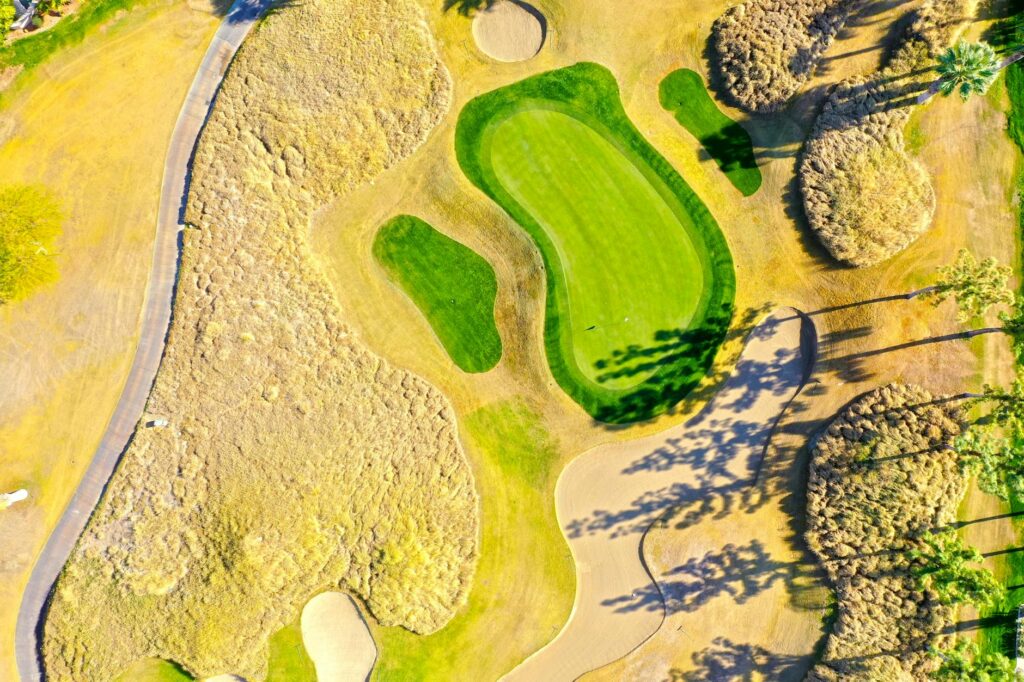 An infographic featuring a top golf courses list with iconic course images. — must-play golf courses