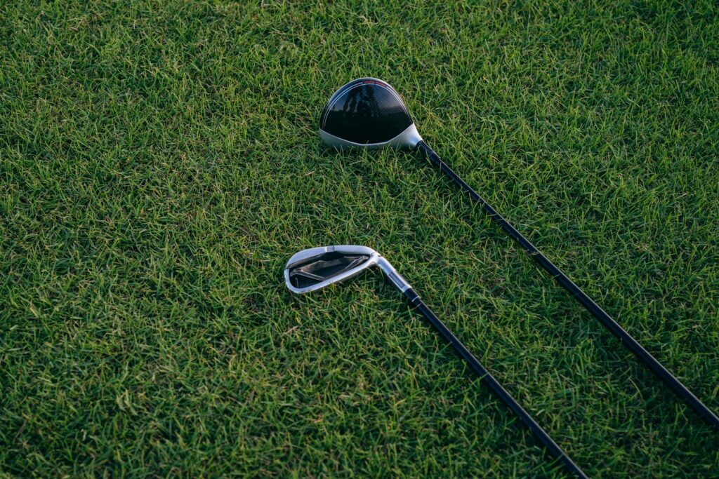 Close-up of the best golf drivers for beginners lined up on a shelf
