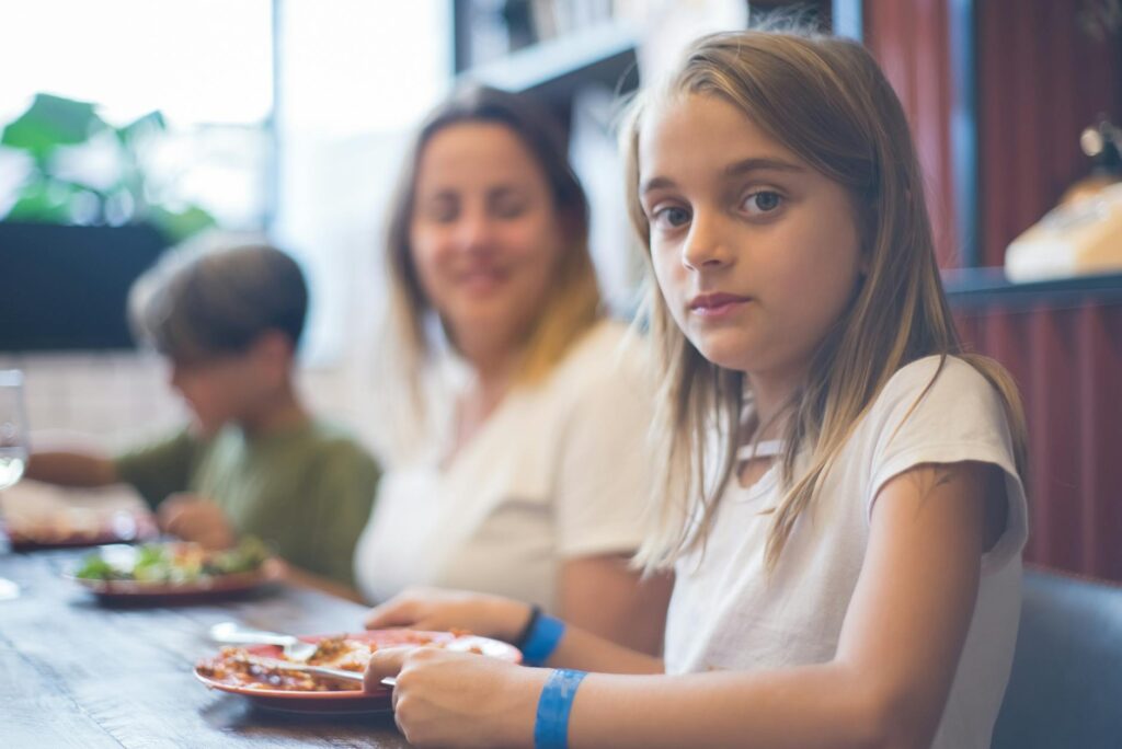 Families dining at a kid-friendly restaurant in Dungeness — family golf activities Dungeness