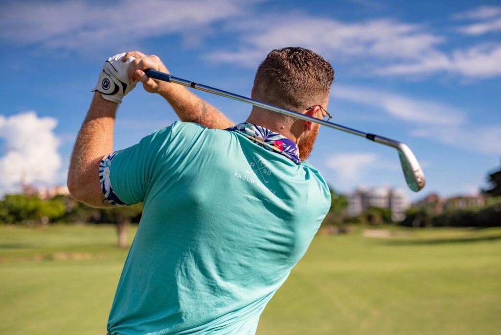 Golfers enjoying a round at a top golf club in Florida, with a vibrant clubhouse in the background. — best golf courses …