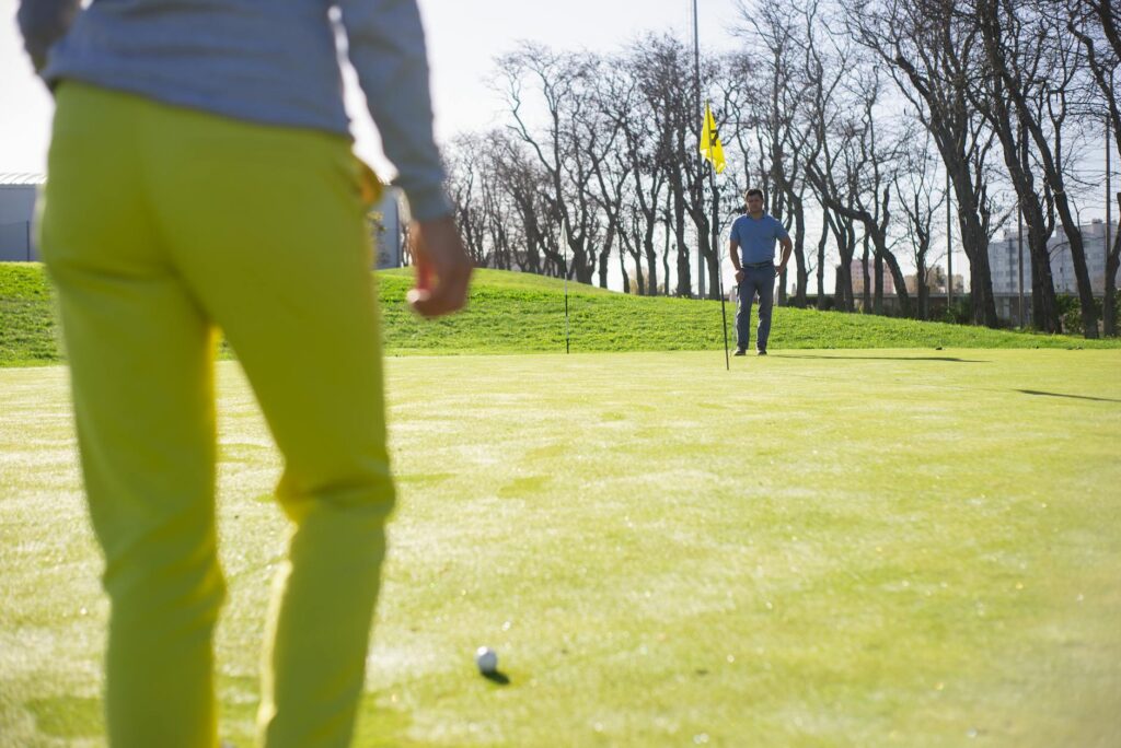 Golfers teeing off on a signature hole at Dungeness. — Dungeness golf experience