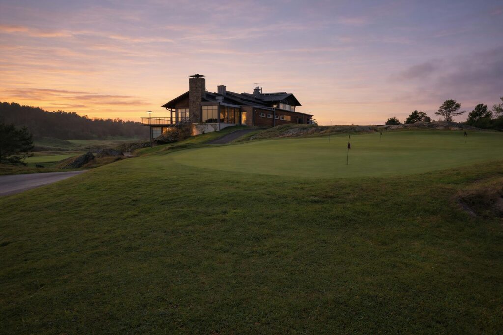 Sunset view over the greens at a Dungeness golf hole — scenic golf holes Dungeness