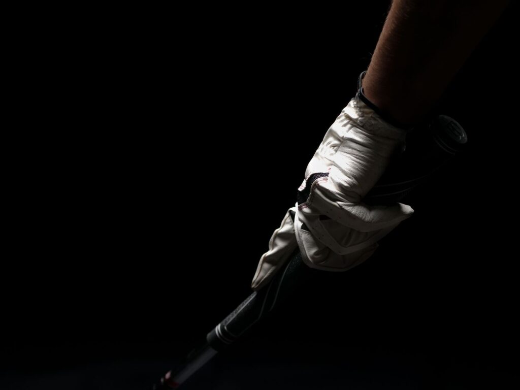 A close-up of a golfer's grip, emphasizing connection and control. — golf swing tempo