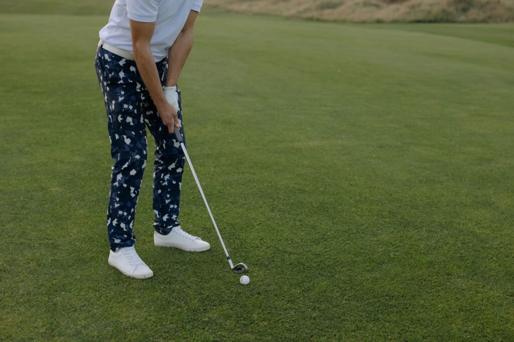 A golfer focusing on their stance and posture before a shot. — golf practice routine