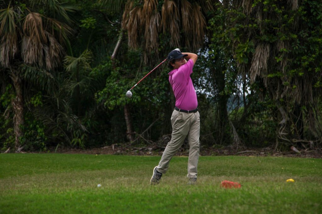 A golfer in mid-swing showcasing a smooth tempo. — golf swing tempo