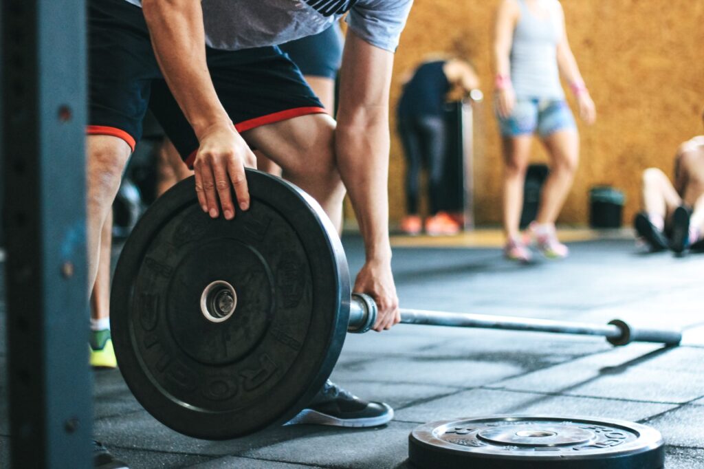 A golfer performing strength training exercises with weights. — golf fitness routine