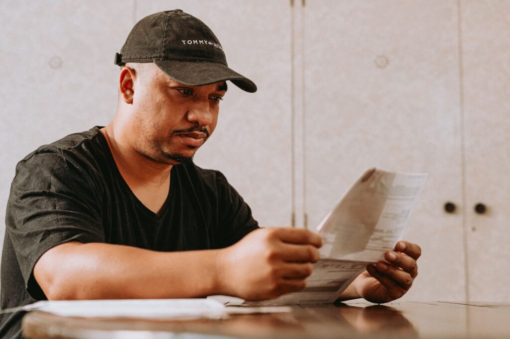 A golfer reviewing their scorecard after a round, highlighting analysis and self-assessment. — improve golf game Dungeness