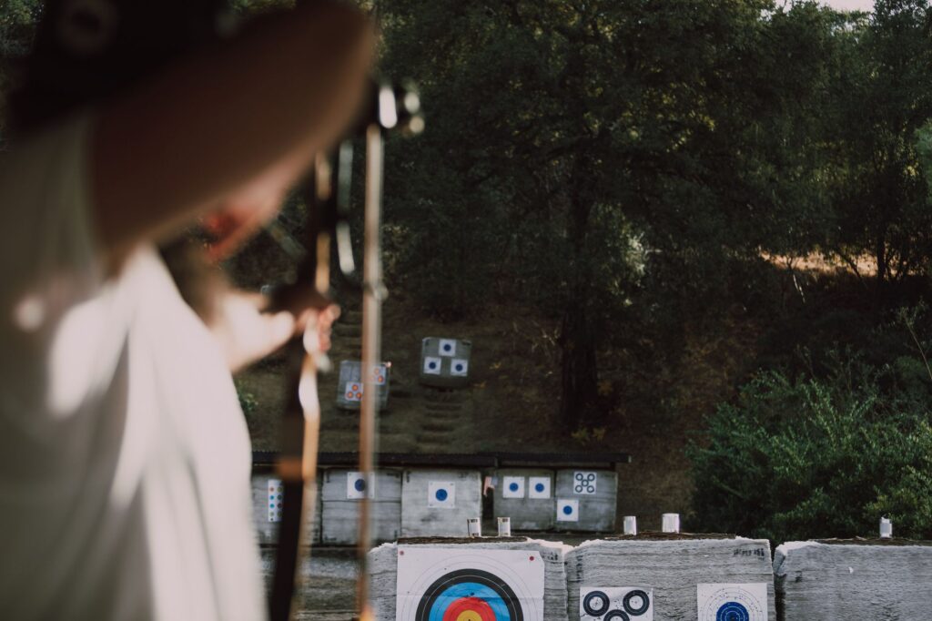 A golfer taking aim at multiple targets during the target practice drill. — golf practice drills