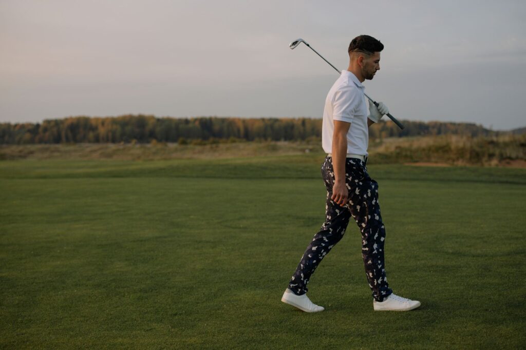 A golfer walking confidently on the course wearing comfortable golf shoes — best golf shoes