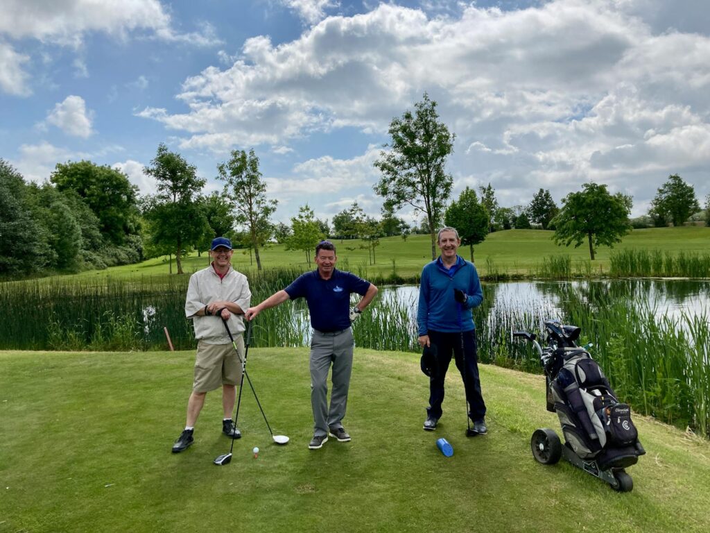 A group of golfers waiting patiently on the tee box. — Dungeness golf etiquette