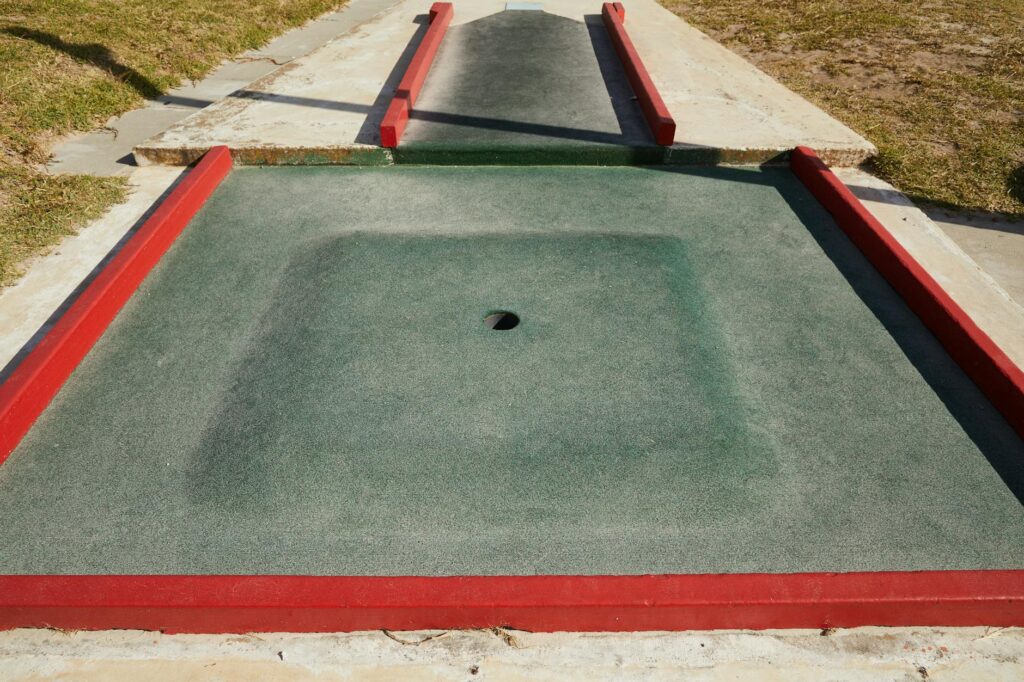 A mini-golf setup designed for families, featuring fun obstacles and colorful decor. — family golf activities Dungeness
