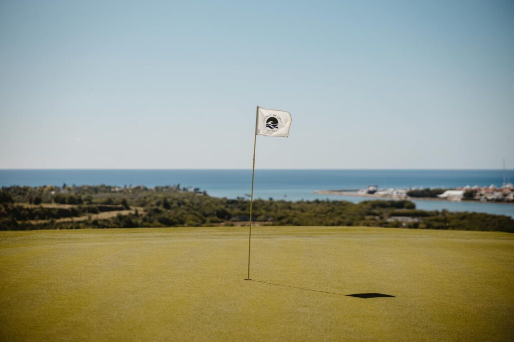 A panoramic view of a Dungeness golf course, showcasing the lush greens and coastal backdrop. — Dungeness golf courses