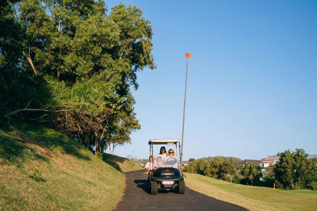 A scenic view of a golf cart on the course, highlighting the convenience of riding. — walking vs riding golf