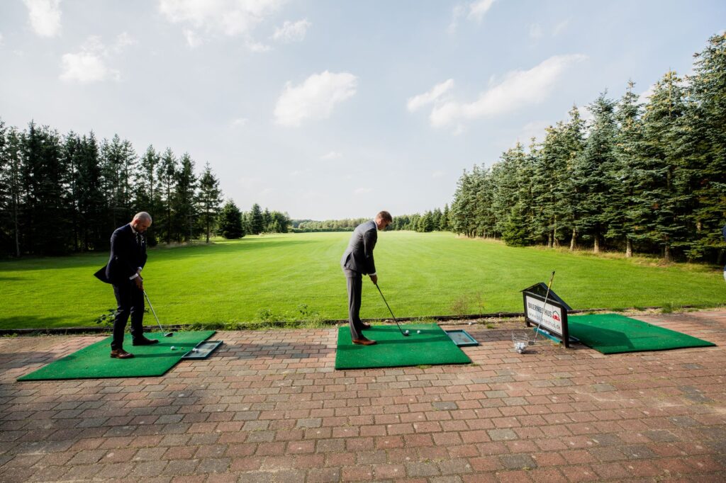 An overview of the Dungeness Golf practice facilities, including driving range and putting greens. — improve golf swing …
